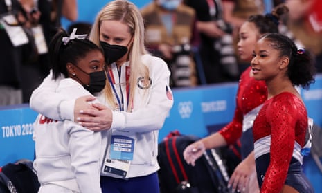 Simone Biles is embraced by coach Cecile Landi after her withdrawal from the women’s all-round gymnastics final