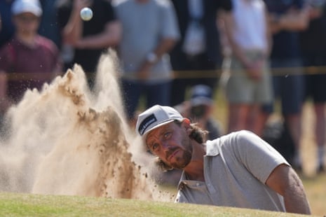 Tommy Fleetwood hits a shot out of a bunker