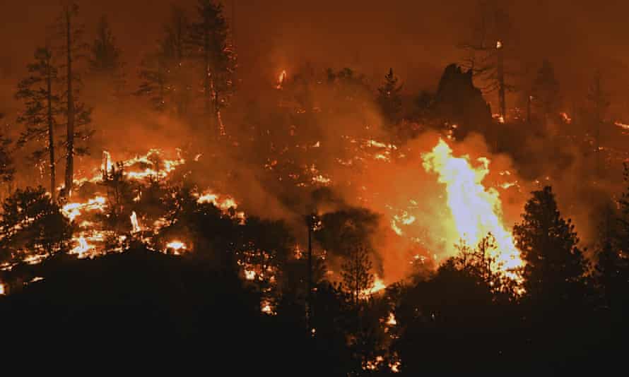 Flames from the Lava fire burn along a ridge near US Highway 97 and Big Springs Road north of Weed, California, on Monday.