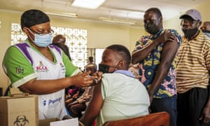 Ugandans receive the Pfizer/BioNTech vaccine in a neighbourhood of Kampala, Uganda.