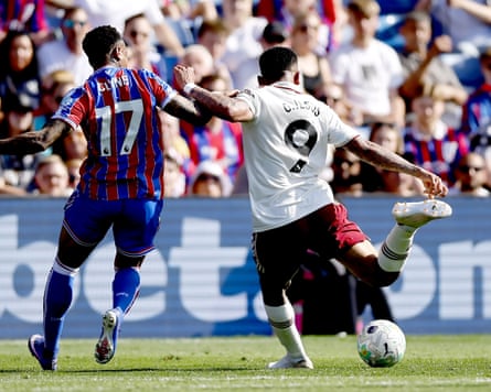 Gabriel Jesus, the Arsenal striker, scores his team’s first goal away at Crystal Palace, despite the attentions of defender Nathaniel Clyne.