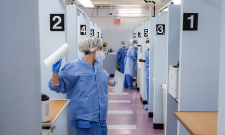 Medical personnel work in the COVID-19 medical screening annex at NYC Health + Hospitals Metropolitan, Wednesday, May 27, 2020, in New York. At hospitals around the country, nurses, doctors and other health care workers are reckoning with the psychological toll of the virus fight, coupled with fears that the disease could flare anew later this year. (AP Photo/John Minchillo)