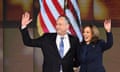 Kamala Harris and husband stand in front of American flag