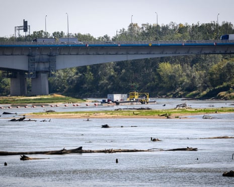 Trucks pass a bridge over the Vistula river just outside the Polish capital, Warsaw.