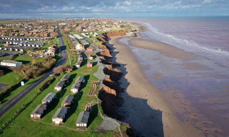 Holiday chalets abandoned due to coastal erosion wait to be demolished or taken by the sea in the village of Withernsea in the East Riding of Yorkshire