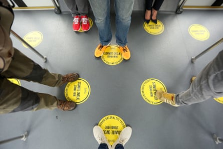 People observe social distancing on a shuttle bus at Franjo Tudjman Airport in Zagreb, Croatia.
