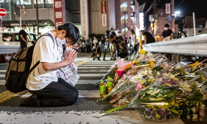 People pray at a site outside of Yamato-Saidaiji Station where Japan’s former prime minister Shinzo Abe was shot