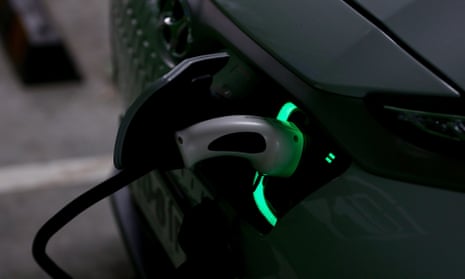 A Hyundai Kona Electric charges at a EV charge station in Sydney