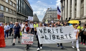 People attend a protest against Covid-19 restrictions, government’s decision of vaccination obligation and Covid-19 health license application brought to some professions in order to combat coronavirus in Paris, France.