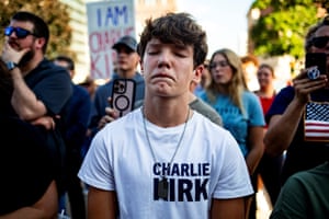 A teenager closes his eyes during a vigil