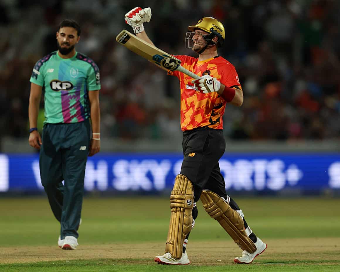 Liam Livingstone of Birmingham Phoenix celebrates victory as Saqib Mahmood of Oval Invincibles looks dejected.