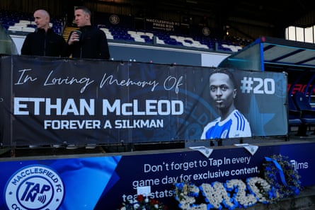 John Rooney, Macclesfield’s manager, stands by the memorial to the late Ethan McLeod before the match against Crystal Palace.
