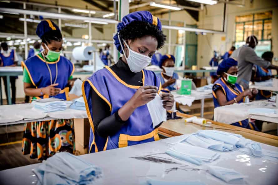 A worker produces face masks at the KICOTEC garment factory in Kitui, Kenya, which has begun 24 hours non-stop work to produce more than 30,000 masks per day