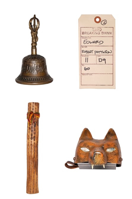Clockwise from top left: a bell, a wardrobe tag, a helmet that looks like a fox, and a musical instrument