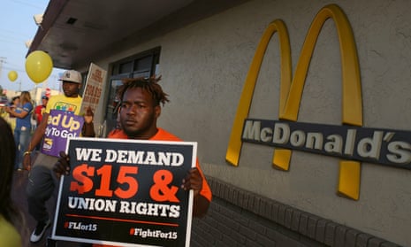 People gather at a McDonald’s restaurant in Miami to demand a minimum wage increase to $15 an hour.