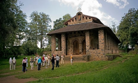 A tour group visits Debre Berhan Selassie Church, Gonder, Ethiopia.