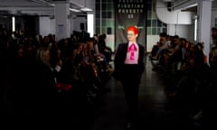 Designer Sandy Powell models a purple 1960s Christian Dior suit in Oxfam’s Fashion Fighting Poverty show at London fashion week.