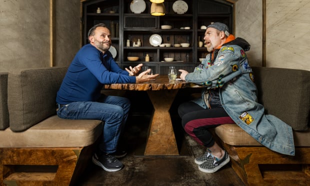 Comedians Geoff Norcott and Rufus Hound chatting at a table at Hide restaurant in London