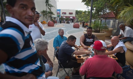 After closing time, men play dominos outside Domino Park on SW 8th St (Calle Ocho) in the Little Havana area of Miami.