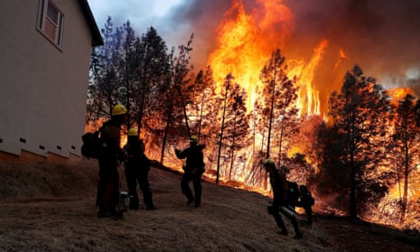 Firefighters monitor a back fire while battling to save homes at the Camp Fire in Paradise, California, in November.