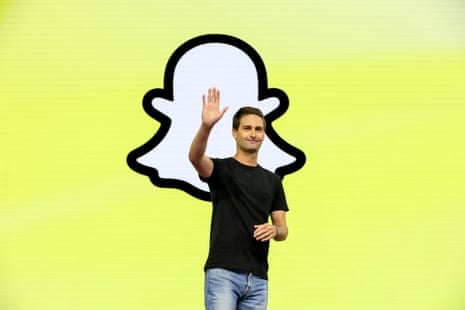 a man waves in front of a ghost logo