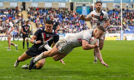 George Williams scores a try for England against France