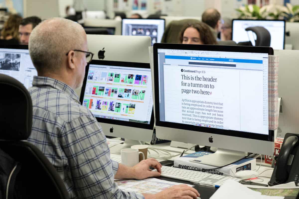 The Guardian newsroom at work on the first edition of the tabloid format