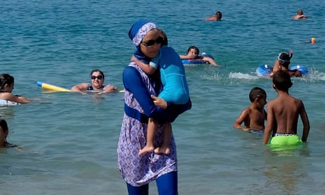 A woman wearing a burkini on a beach in Marseille the day after the country’s highest administrative court suspended a ban on full-body swimsuits.