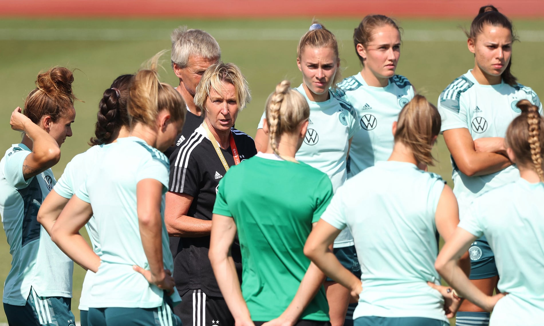 Germany’s head coach, Martina Voss-Tecklenburg, leads a huddle in training.