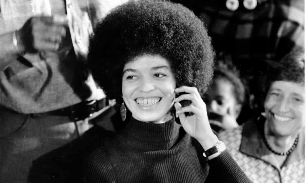 Angela Davis, right, sits in court with her attorneys John Abt and Margaret Burnham, left, Dec. 24, 1970 in San Rafael. Ms. Davis faces kidnap, murder and conspiracy charges as a result of an August shoot out in which a Marin County Superior Court judge and three others were slain. (AP Photo)