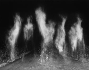 dusty shadows rising in the air outside