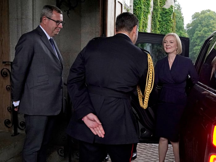Liz Truss being greeted by the Queen’s equerry, Lieutenant Colonel Tom White, and her private secretary, Sir Edward Young, as she arrives at Balmoral for the audience where she will be appointed prime minister.