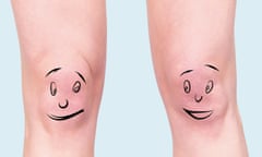 Someone's knees with faces drawn on, which are looking at each other through the corners of their eyes in comedic fashion.