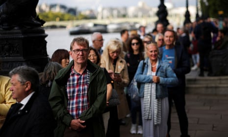 People stand in a queue in London to pay their respects to the Queen.