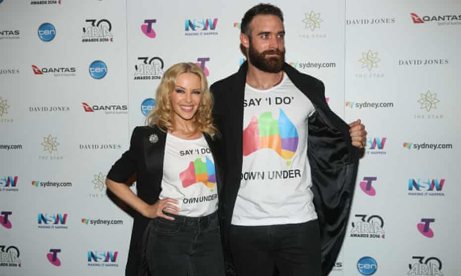 Kylie Minogue and per partner Joshua Sasse make a surprise appearance at the 30th annual Aria awards at the Star in Sydney on Wednesday evening in pro marriage equality T-shirts. 