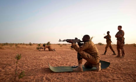 Soldiers of the Burkina Faso army take part in shooting exercises during a joint operation with the French army