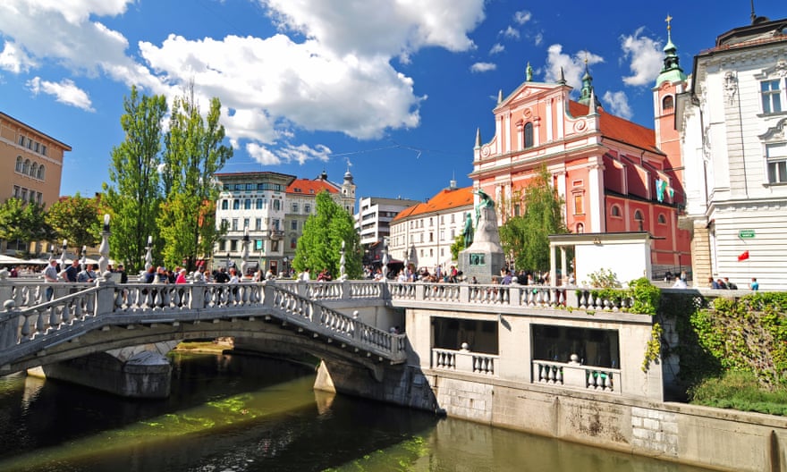 Ljubljana, Slovenia, Triple bridges and St. Francis church in the background on a brigh sunny day