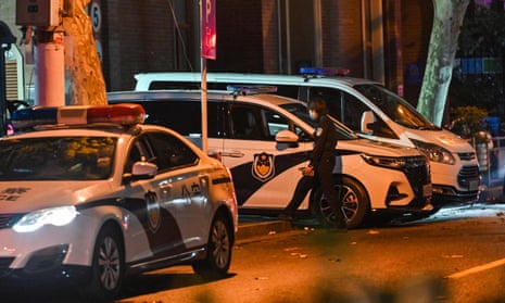 Police cars are seen in Shanghai, China, a day after rare protests against zero-Covid policy.