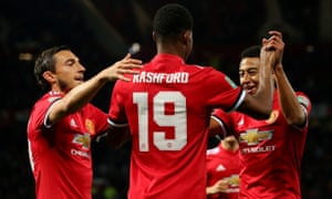 Marcus Rashford is congratulated on putting Manchester United 1-0 up against Burton Albion by Matteo Darmian and Jesse Lingard