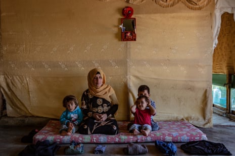Nafla, 35, with three of her four children