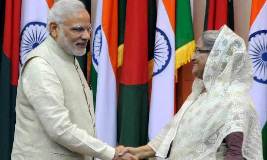Indian prime minister Narendra Modi shakes hands with Bangladeshi prime minister Sheikh Hasina during his visit to Bangladesh.