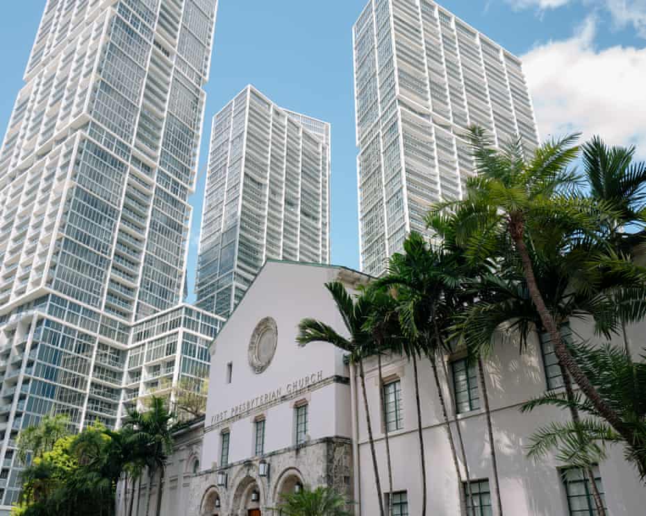 High rises tower over a church