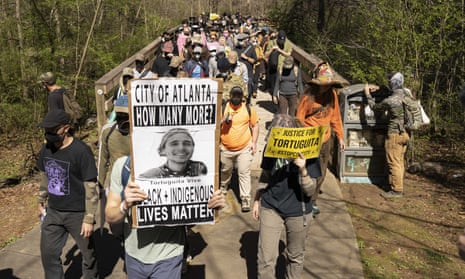 Hundreds of people march to protest ‘Cop City’ in Atlanta, Georgia, on 4 March.