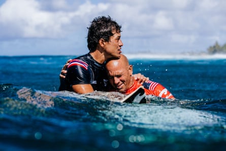 Seth Moniz embraces Slater after the 2022 Billabong Pro Pipeline final in Hawaii.