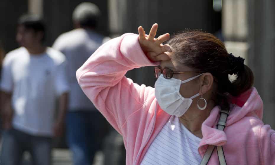 A woman wears a mask to protect herself against air pollution in Mexico City.