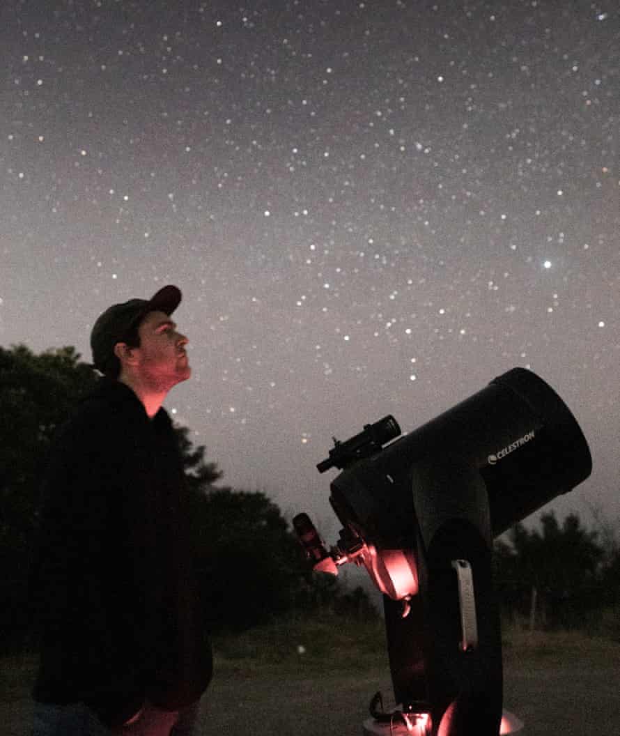 Astronomer Rob Davison with his telescope.