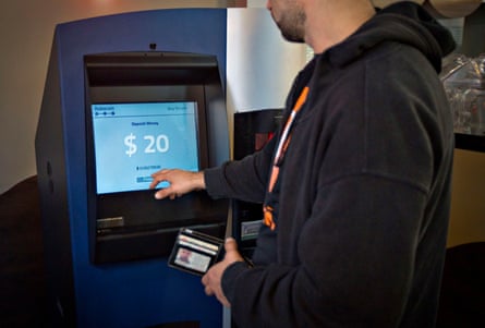 A customer using the world’s first permanent bitcoin ATM, unveiled at a coffee shop in Vancouver in 2013.