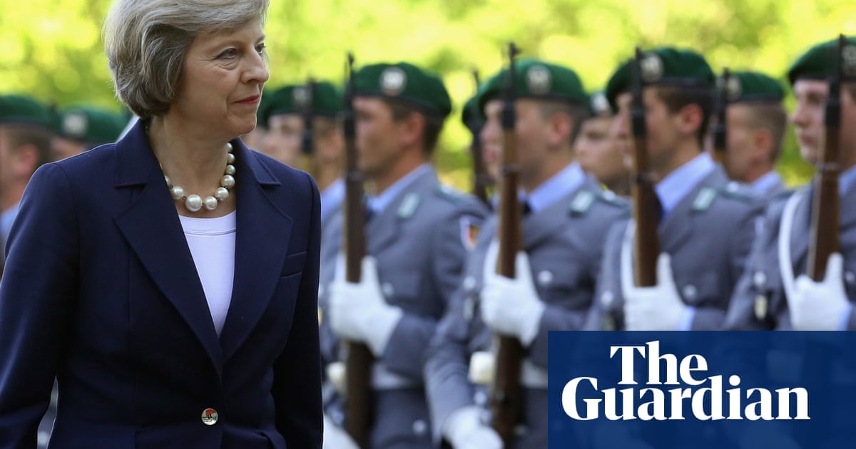 theresa may visits angela merkel in