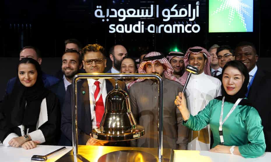 People prepare for Saudi Aramco to be listed on the stock exchange in Riyadh