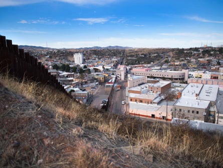 The border fence stretching through Nogales, Arizona, and Nogales, Mexico